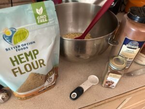 hemp flour on counter with spices for preparing oatmeal cake