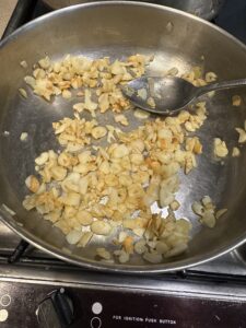 garlic being toasted for Savory Hemp Heart Sticky Rice